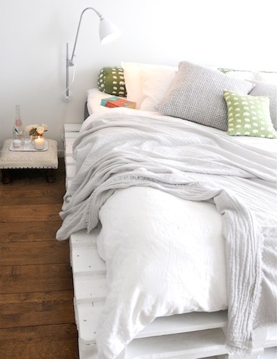 white painted shipping pallet bed