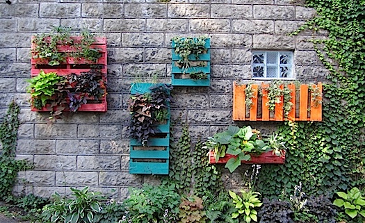 colorful planters made of shipping pallets