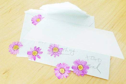 a letter with dried flowers
