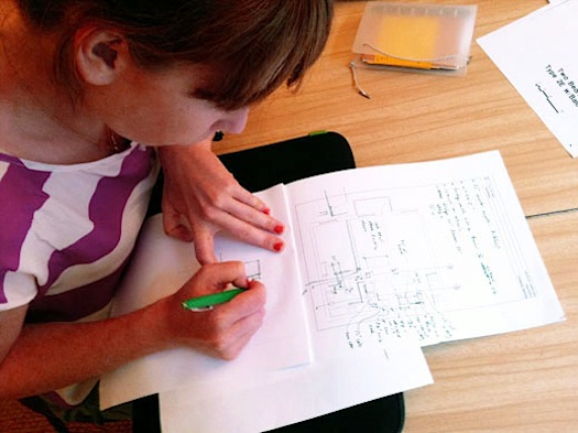 Emily Johnson notating plans for Improvised Life Laboratory