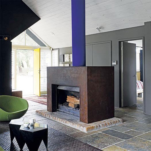 a cor-ten steel fireplace makes for a chic industrial look