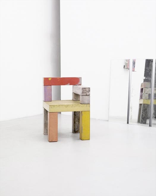 chairs made from colorful concrete beams